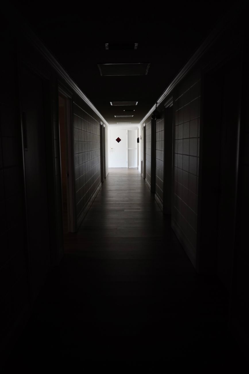 a dark hallway of a building